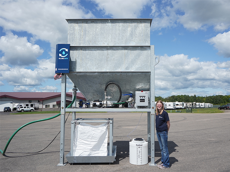 Woman standing in front of slurry separation unit